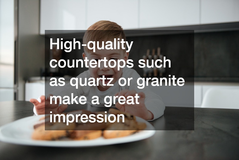 boy grabbing cookies on a countertop